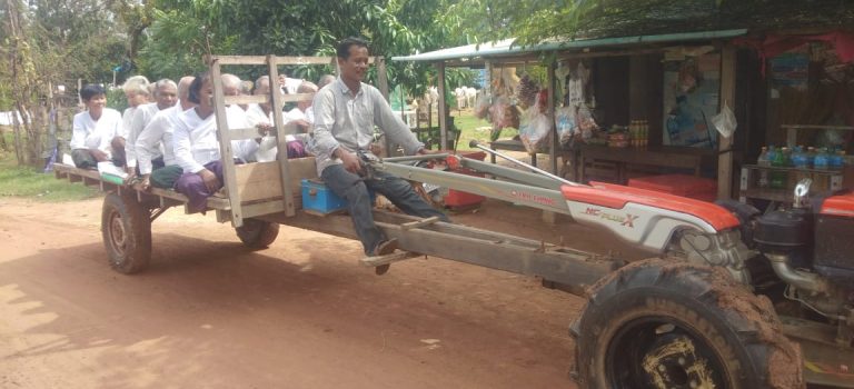 PHOTO 9 PROJECTS - HAND HELD TRACTOR TRANSPORTING PEOPLE